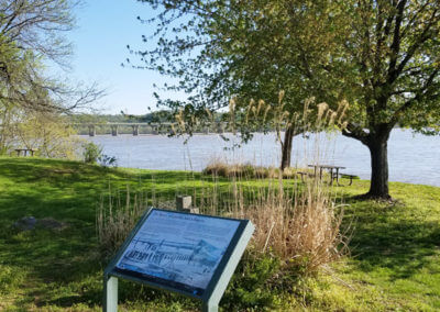 Wildlife Sign and View of Trees and Water