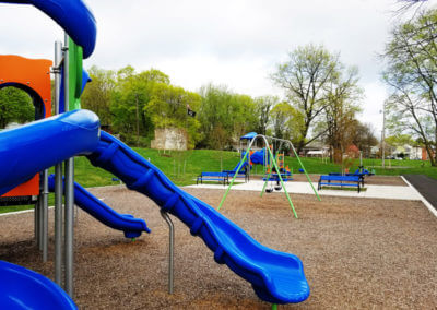 Children's Playground With Sliding Board and Swings