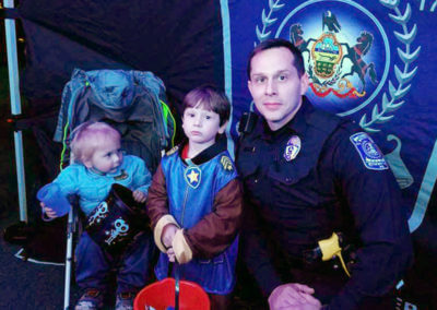 Policeman with 2 Young Children