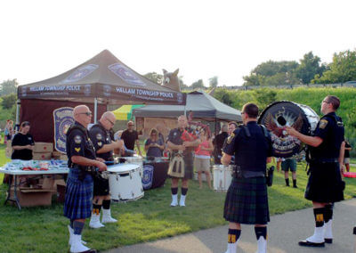 Police in Kilts Playing Musical Instruments